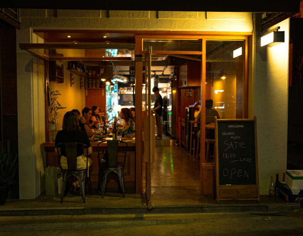 The warm and cozy interior lighting of Sate Wine Bar