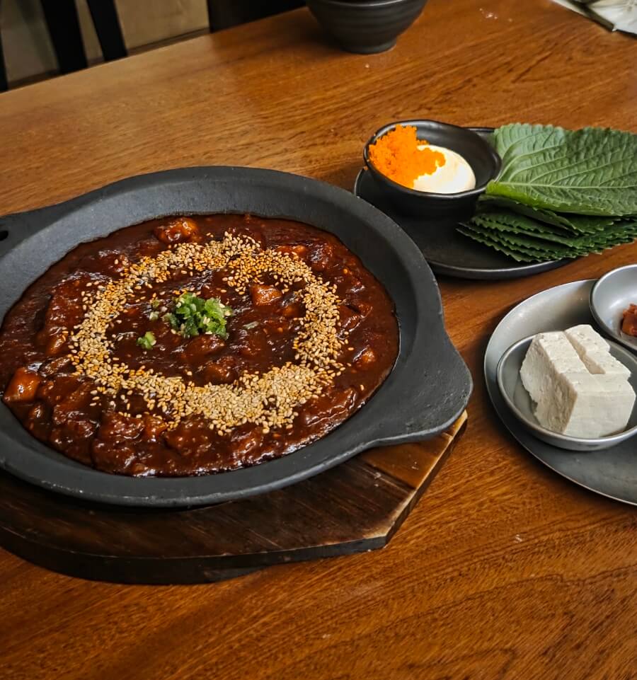 spicy stir-fried beef tendon (bulseuji) in bold red sauce, a signature drinking snack at Sogeukjeok Hannam
