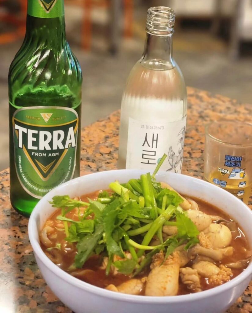 A glass of Somaek, a popular Korean cocktail of Soju and beer.