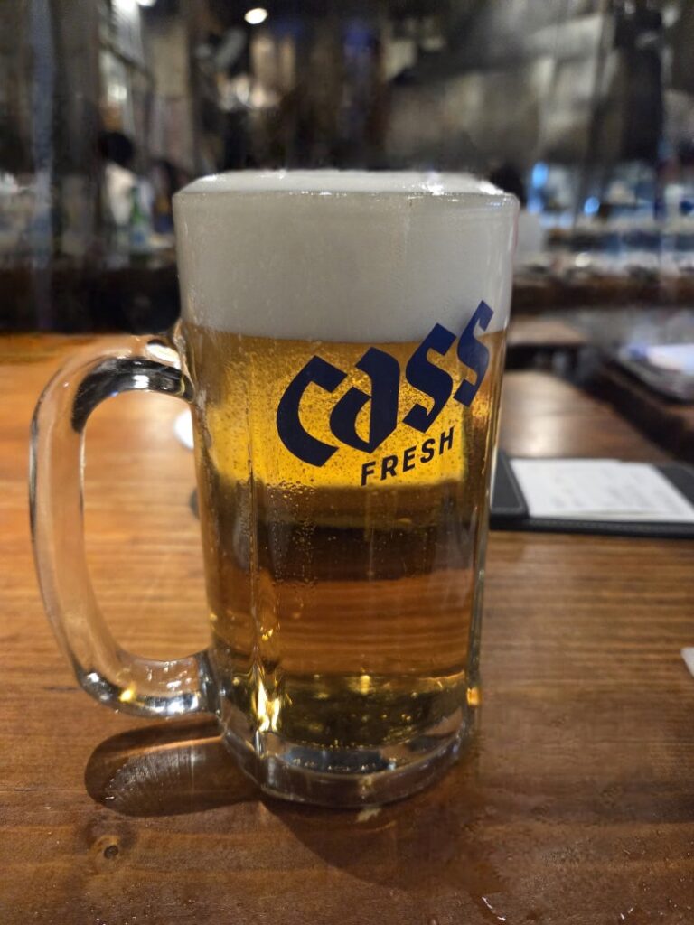 Cold Cass draft beer at Dalmaji Plaza BBQ outdoor seating, Euljiro Seoul