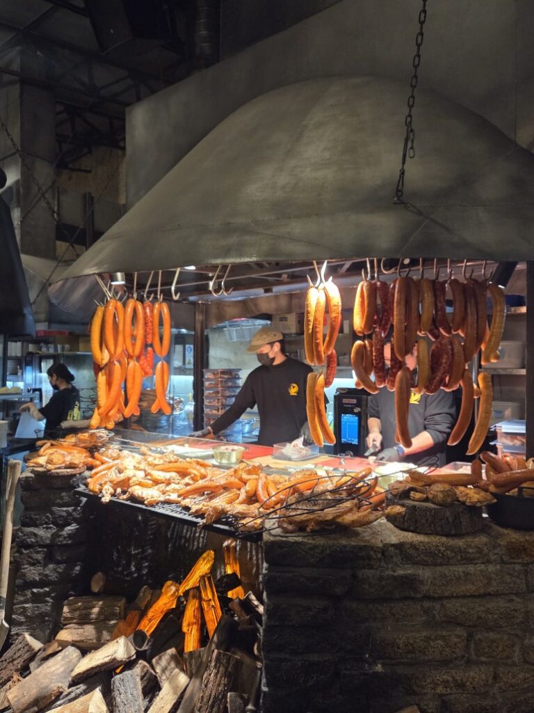 Handmade black pork sausages hanging at Dalmaji Plaza BBQ sausage station, Euljiro Seoul