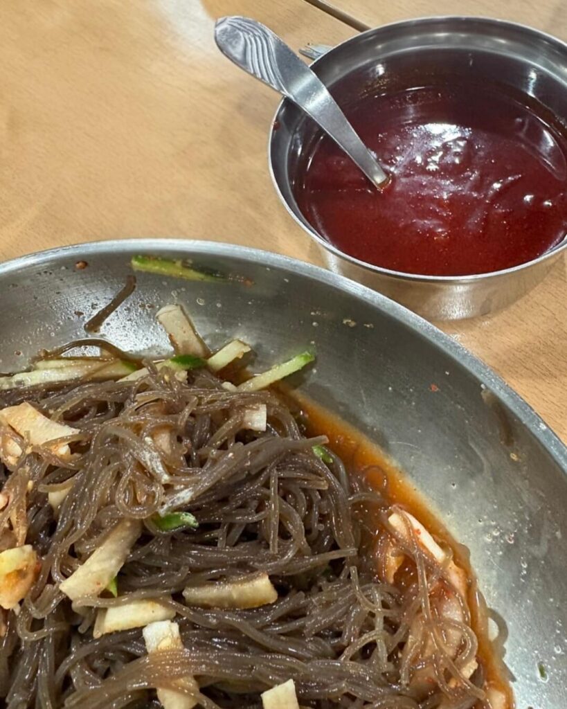 Extra spicy sauce on the table — add as much as you dare.