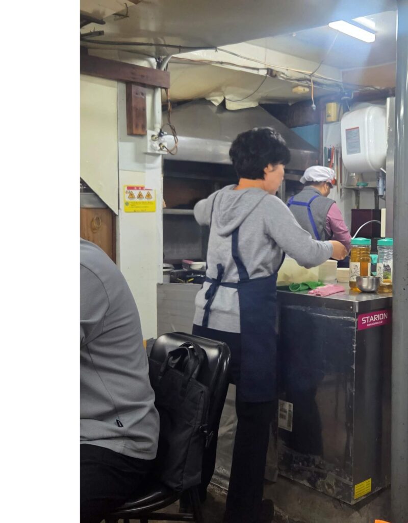 The vintage open kitchen at Sanbul Deungsim — an authentic Nopo atmosphere that has remained unchanged for decades
