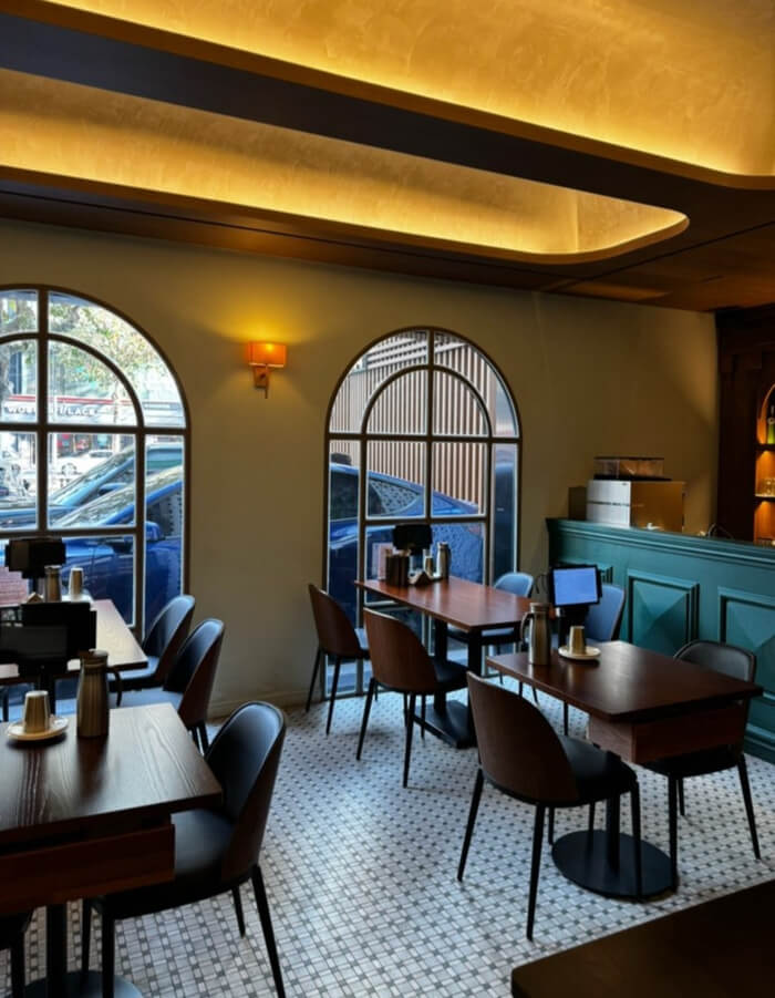 Cafe-style interior of Myeon Seoul in Apgujeong with clean minimal design, two and four-person tables, and classical music — a contrast to typical fast-paced Korean noodle restaurants