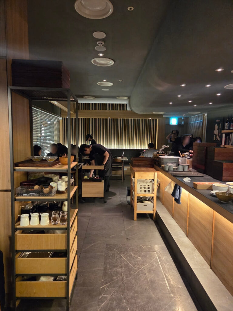 Cozy dining hall interior at Negi Sukiyaki Andaz Hotel Apgujeong with table seats, bar counter, and private room options