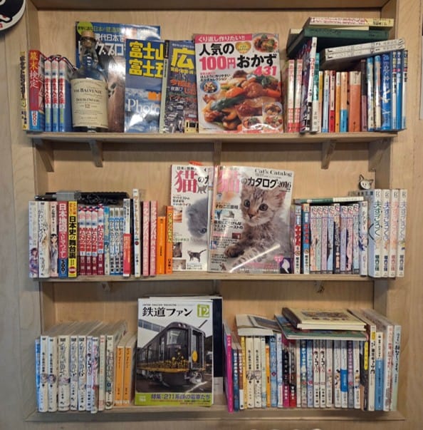 Japanese magazines, sake bottles, and vintage collectibles on display inside Tetsuro Seoul.