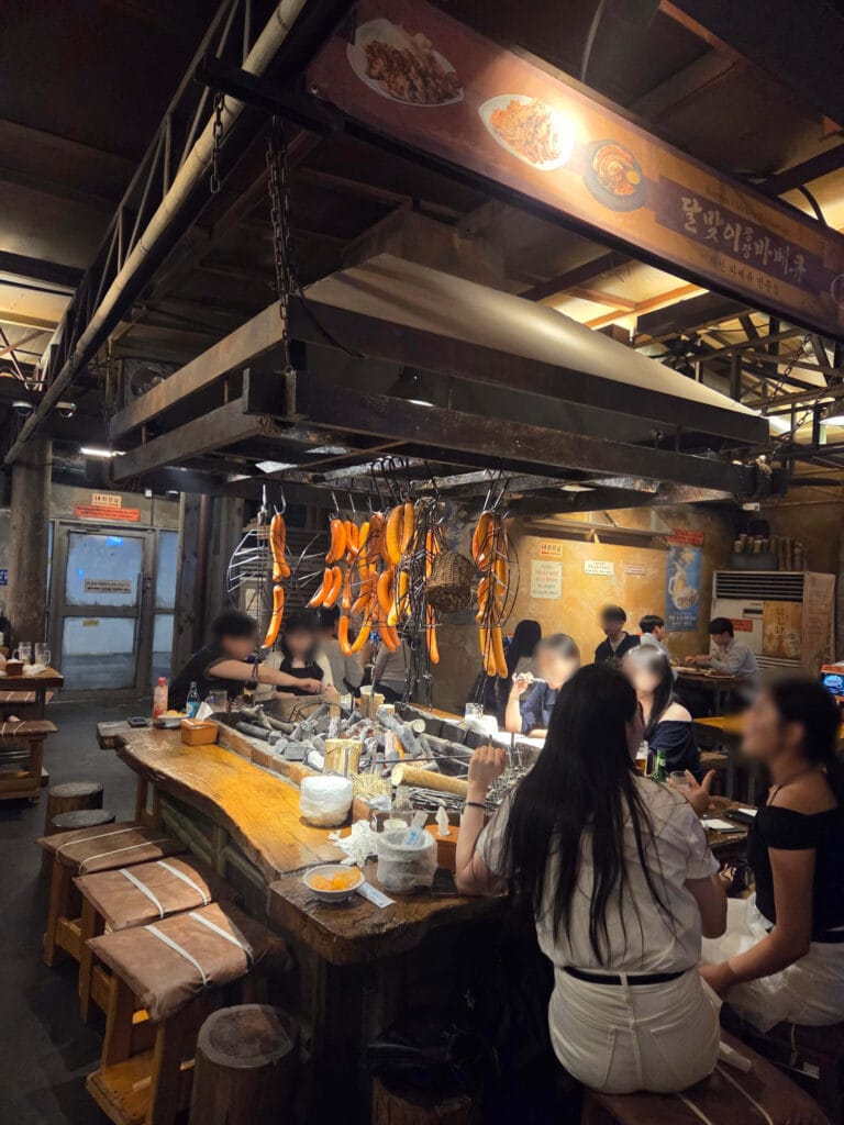 Charcoal grill counter seating at Dalmaji Plaza BBQ