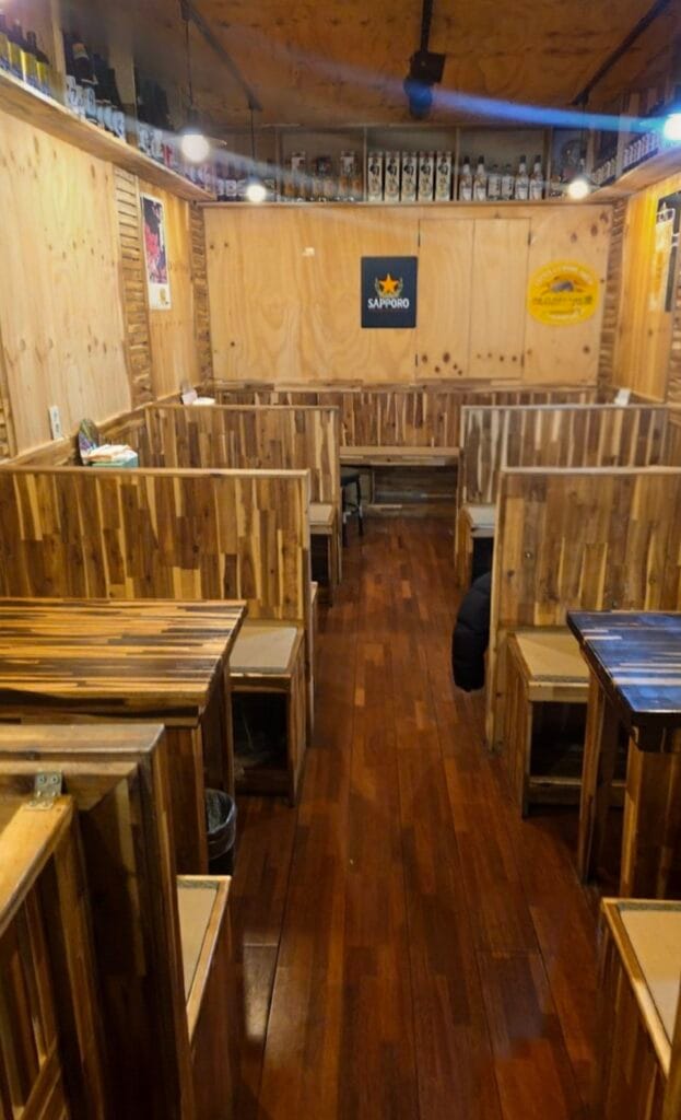 Cozy indoor seating area typical of Korean nopo restaurants.
Small tables placed closely, creating a lively atmosphere