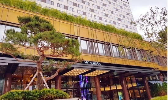The hotel entrance exudes a trendy, boutique hotel vibe.
