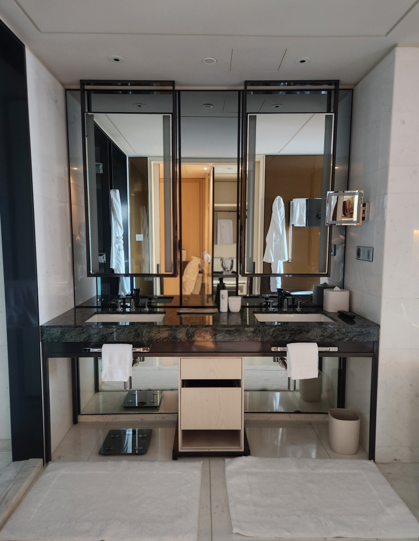A well-designed bathroom featuring a double vanity, ensuring maximum convenience even when used by a family