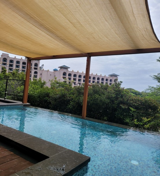 The pool villa features a spacious private heated pool that easily fits a group of people