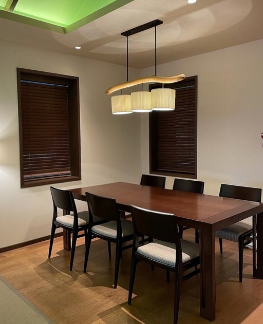 A spacious Lotte Hotel Jeju suite pool villa with a dining area that comfortably seats six