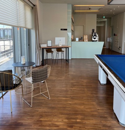 A convenient community space featuring a karaoke room and a convenience store