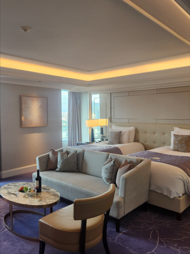 An overall cozy ambiance with a generous bedroom size that comfortably accommodates up to three guests.