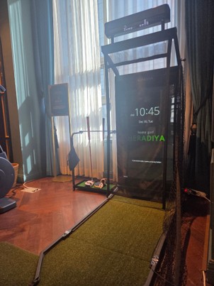 The fitness facility is compactly and efficiently organized with both a golf zone and a weight training zone