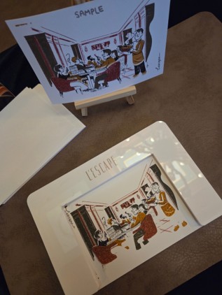 I created a custom postcard that perfectly captures the signature mood of L'Escape Hotel