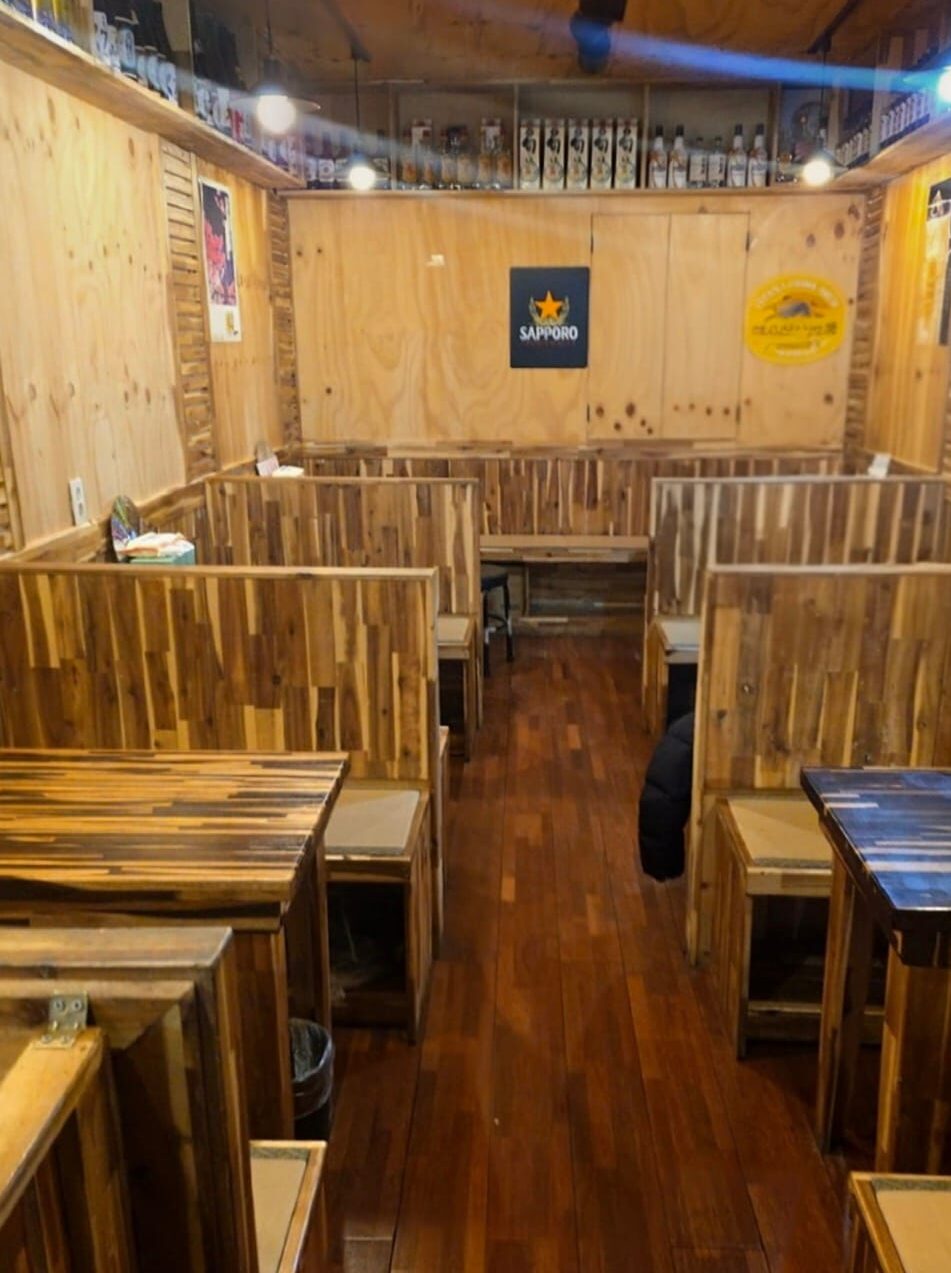 Cozy indoor seating area typical of Korean nopo restaurants.
Small tables placed closely, creating a lively atmosphere
